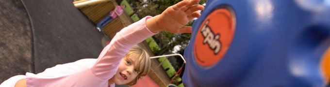 child reaching for an i.spin button